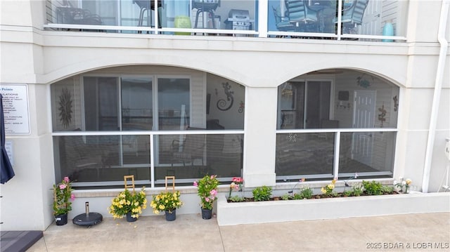 view of side of home featuring a balcony