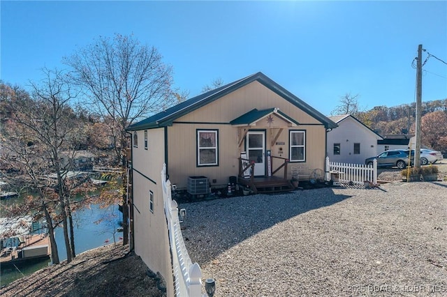 27085 Dixie Ln, Barnett, MO 65011 - view of front of home featuring fence and central AC