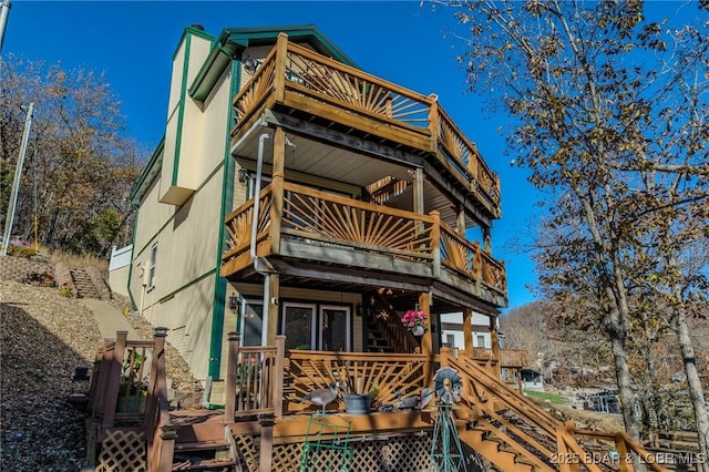 27085 Dixie Ln, Barnett, MO 65011 - rear view of property featuring a wooden deck, a balcony, and stairway