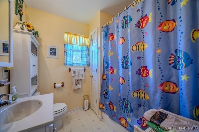 27085 Dixie Ln, Barnett, MO 65011 - full bath with a shower with curtain, toilet, baseboards, vanity, and tile patterned floors