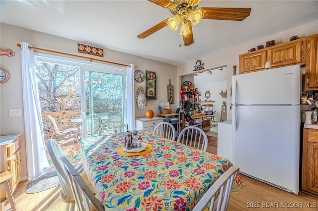 27085 Dixie Ln, Barnett, MO 65011 - dining area featuring ceiling fan and light wood finished floors