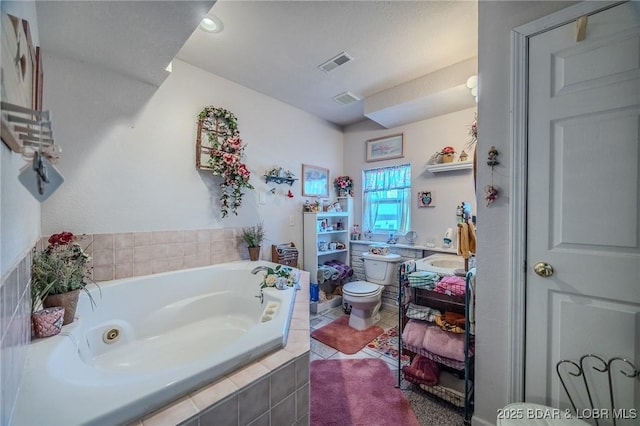 27085 Dixie Ln, Barnett, MO 65011 - full bathroom with vanity, a bath, and toilet