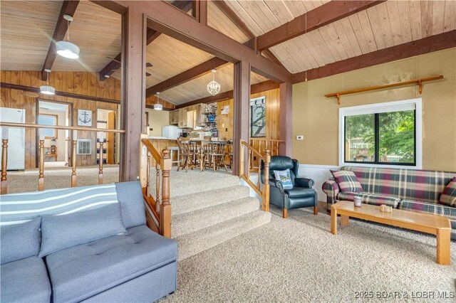 424 Bowers Dr, Camdenton, MO 65020 - carpeted living room with wooden walls, wood ceiling, wainscoting, and stairs