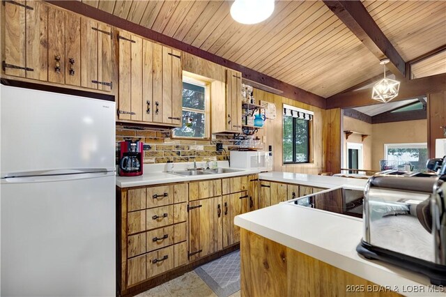 424 Bowers Dr, Camdenton, MO 65020 - kitchen featuring white appliances, light countertops, plenty of natural light, wood ceiling, and tasteful backsplash