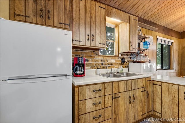 424 Bowers Dr, Camdenton, MO 65020 - kitchen with white appliances, healthy amount of natural light, light countertops, tasteful backsplash, and wood ceiling