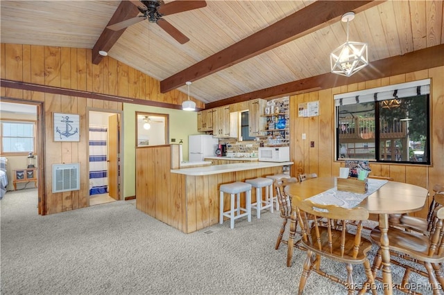 424 Bowers Dr, Camdenton, MO 65020 - dining area with ceiling fan, wood walls, light carpet, wood ceiling, and heating unit