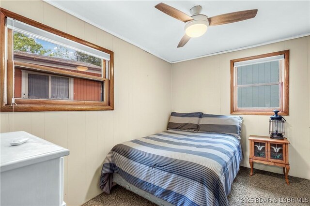 424 Bowers Dr, Camdenton, MO 65020 - carpeted bedroom with ceiling fan and crown molding