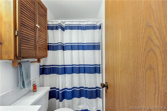 424 Bowers Dr, Camdenton, MO 65020 - bathroom featuring toilet and curtained shower