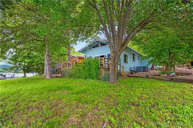 424 Bowers Dr, Camdenton, MO 65020 - view of green lawn with a wooden deck