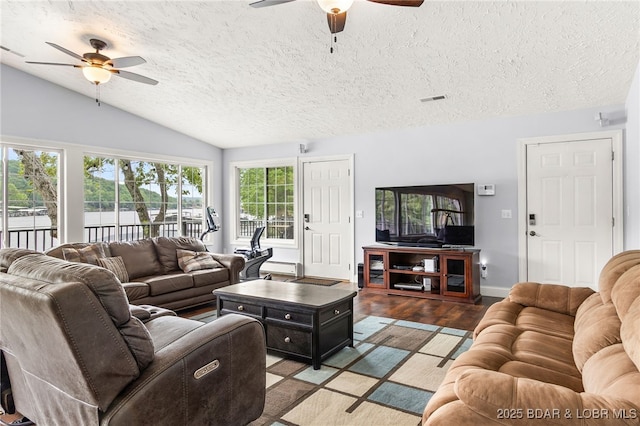 12 Mimosa Rd, Rocky Mount, MO 65072 - living area featuring ceiling fan, wood finished floors, vaulted ceiling, a textured ceiling, and baseboards