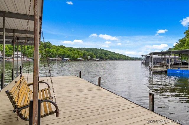 12 Mimosa Rd, Rocky Mount, MO 65072 - dock with a water view and a wooded view