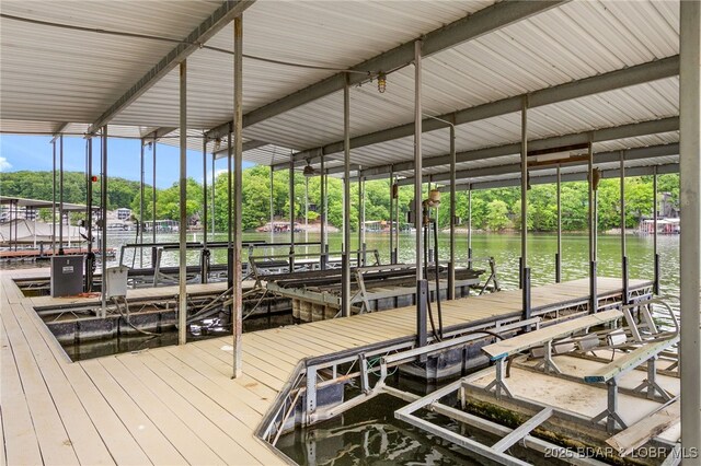 12 Mimosa Rd, Rocky Mount, MO 65072 - dock featuring a water view, boat lift, and view of scattered trees