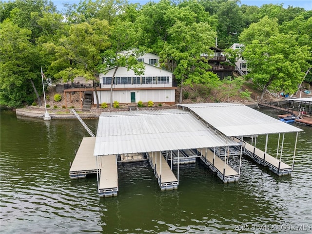 12 Mimosa Rd, Rocky Mount, MO 65072 - dock with stairway, boat lift, and a deck with water view