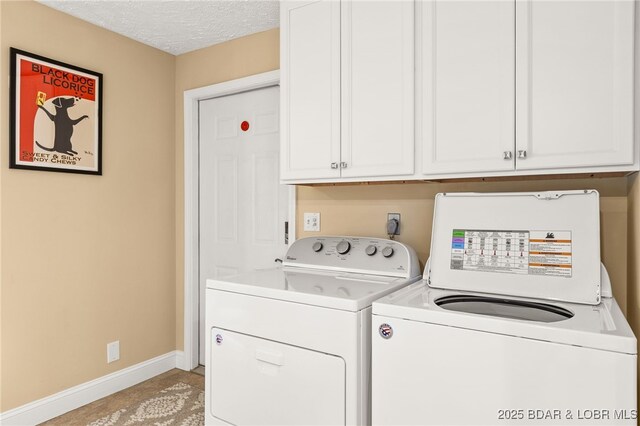 12 Mimosa Rd, Rocky Mount, MO 65072 - laundry area with washing machine and dryer, cabinet space, baseboards, and a textured ceiling