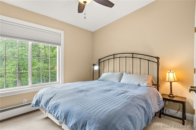 12 Mimosa Rd, Rocky Mount, MO 65072 - bedroom with carpet floors, baseboard heating, baseboards, and ceiling fan