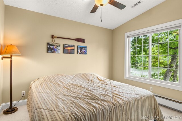 12 Mimosa Rd, Rocky Mount, MO 65072 - bedroom with a baseboard radiator, carpet flooring, vaulted ceiling, baseboards, and ceiling fan