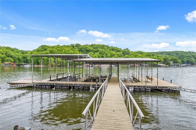 12 Mimosa Rd, Rocky Mount, MO 65072 - dock featuring a wooded view, a water view, and boat lift