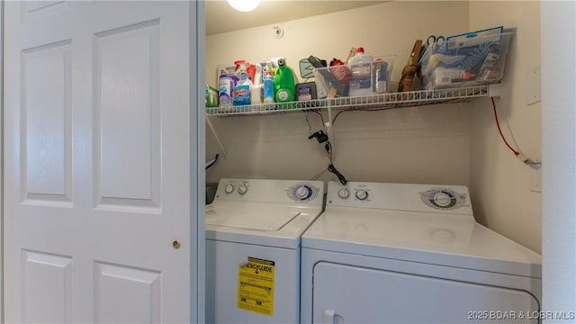 clothes washing area featuring washing machine and clothes dryer
