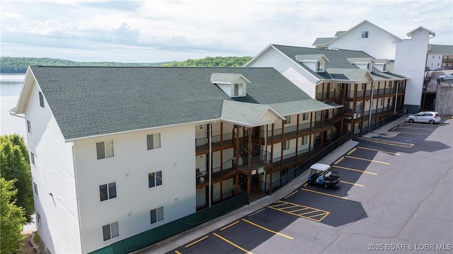 view of property featuring uncovered parking
