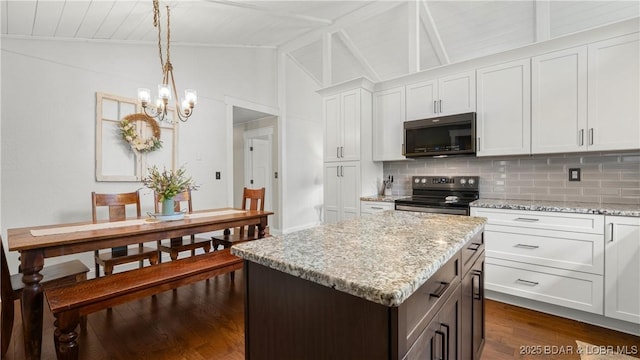 kitchen with stainless steel range with electric stovetop, dark wood finished floors, tasteful backsplash, a chandelier, and white cabinets