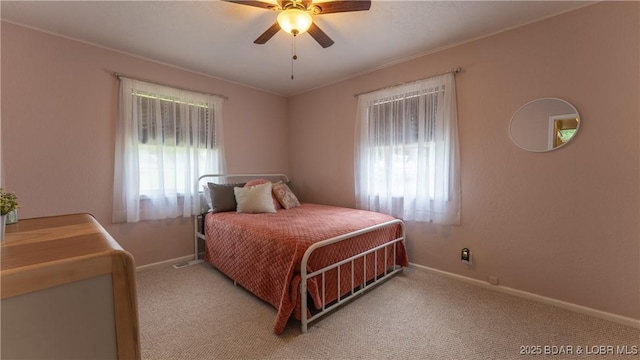 bedroom featuring baseboards, carpet, and a ceiling fan