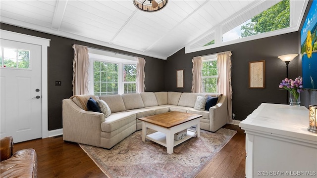 living room with healthy amount of natural light, hardwood / wood-style flooring, and wooden ceiling