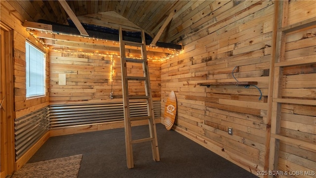 unfurnished bedroom featuring wood walls, lofted ceiling, and carpet flooring