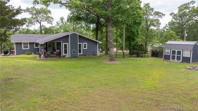 view of yard featuring a shed and an outdoor structure