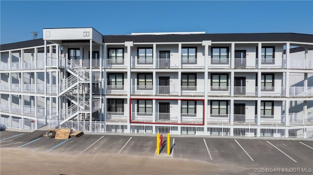 1045 Topsider Ln Unit 314, Osage Beach, MO 65065 - view of apartment building / complex featuring uncovered parking