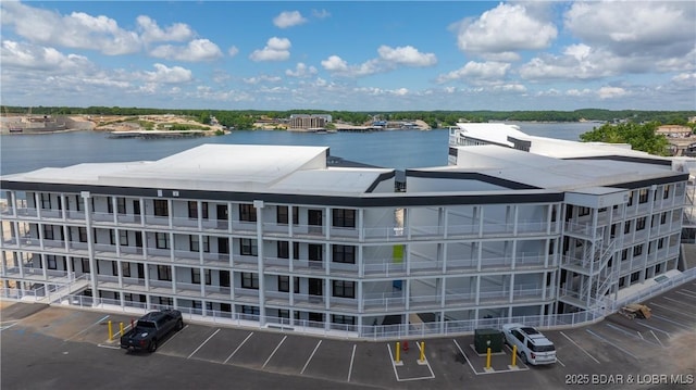 1045 Topsider Ln Unit 314, Osage Beach, MO 65065 - view of apartment building / complex with uncovered parking and a water view