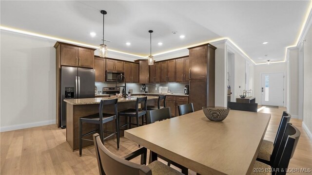 1045 Topsider Ln Unit 314, Osage Beach, MO 65065 - dining space featuring light wood-style flooring, baseboards, and recessed lighting
