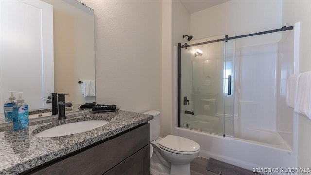 1045 Topsider Ln Unit 314, Osage Beach, MO 65065 - bathroom featuring toilet, vanity, and enclosed tub / shower combo