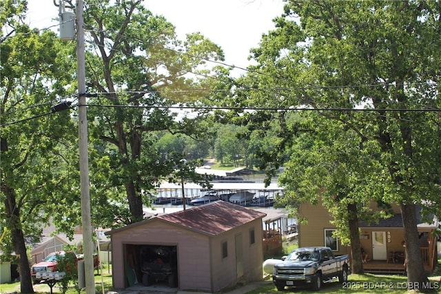 exterior space featuring an outbuilding and a garage