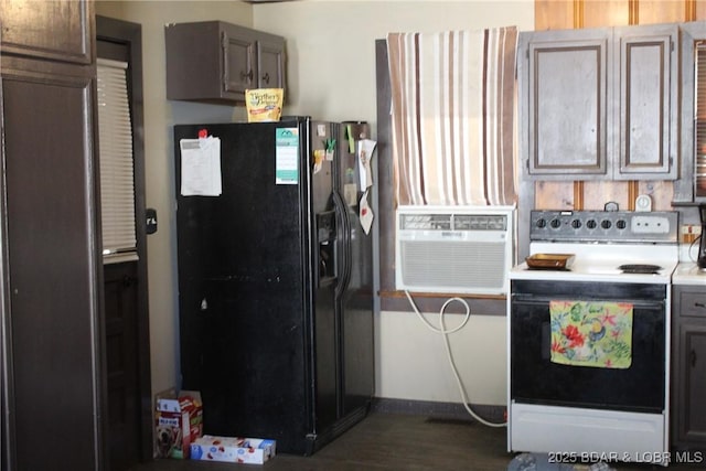 kitchen featuring black fridge, electric stove, dark wood-style floors, cooling unit, and baseboards