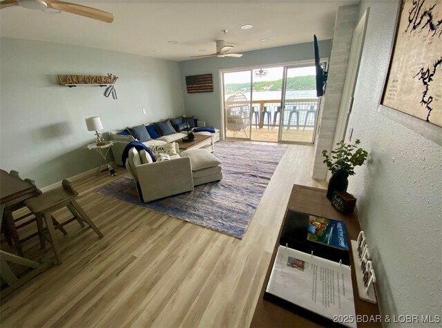 1481 Ledges Dr Unit 1019, Osage Beach, MO 65065 - living room with ceiling fan and wood finished floors