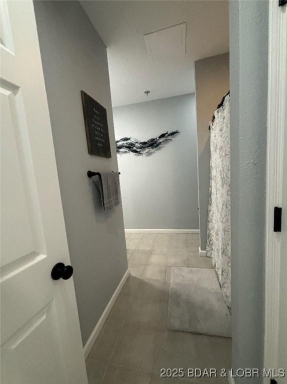 1481 Ledges Dr Unit 1019, Osage Beach, MO 65065 - bathroom featuring tile patterned floors and baseboards