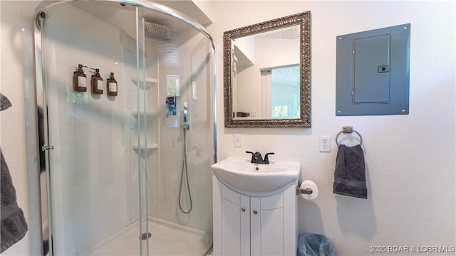 115 Hacksaw Ln, Camdenton, MO 65020 - full bathroom with electric panel, a shower stall, and vanity