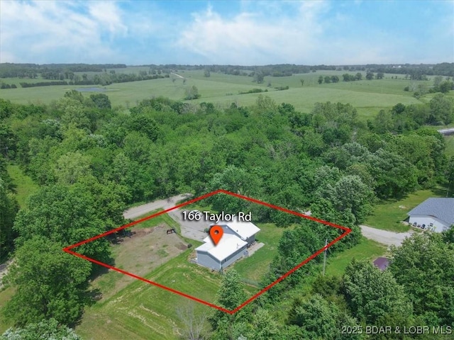 aerial view of sparsely populated area featuring property parcel outlined