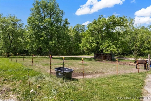 view of yard featuring a view of trees
