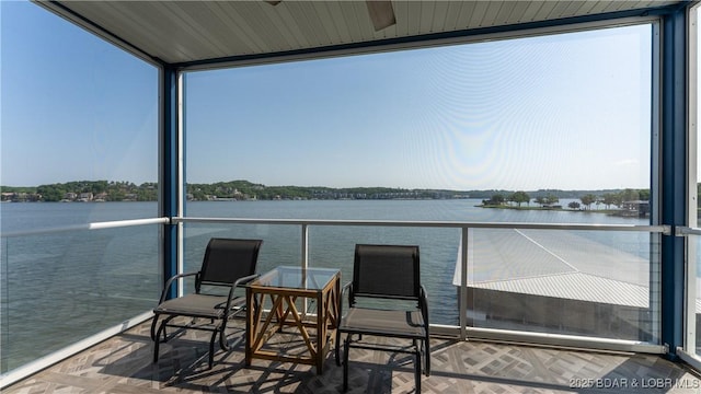 balcony featuring a water view
