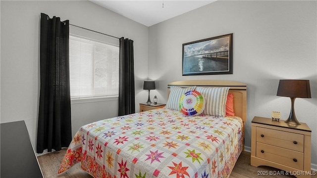 bedroom featuring wood finished floors