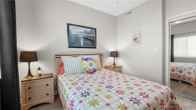 bedroom with wood finished floors