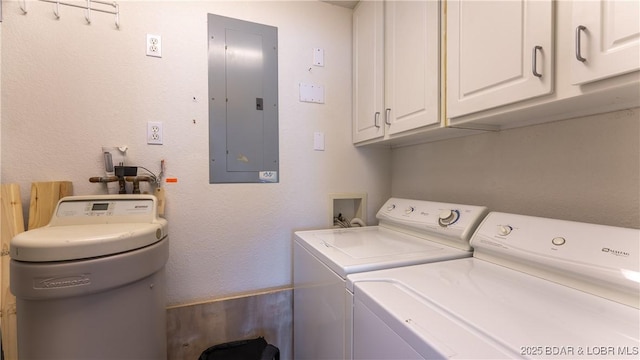laundry area with electric panel, cabinet space, and washer and clothes dryer