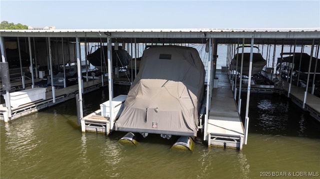 dock area featuring a water view and boat lift