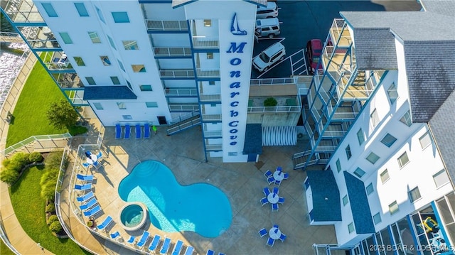 aerial view of a pool and apartment complex