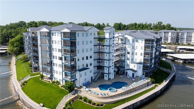 view of apartment building / complex featuring a water view