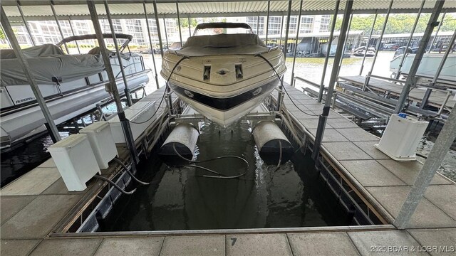 18130 Millstone Cove Rd Unit 447, Gravois Mills, MO 65037 - dock area with boat lift and a water view