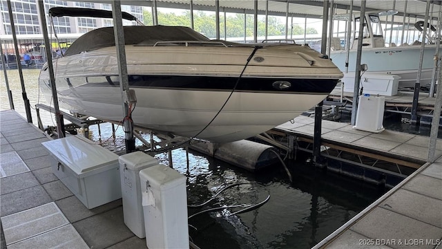 18130 Millstone Cove Rd Unit 447, Gravois Mills, MO 65037 - dock featuring boat lift and a water view