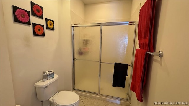 18130 Millstone Cove Rd Unit 447, Gravois Mills, MO 65037 - bathroom with a stall shower, toilet, and tile patterned flooring
