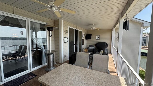 18130 Millstone Cove Rd Unit 447, Gravois Mills, MO 65037 - view of patio / terrace featuring a ceiling fan and outdoor dining area